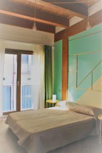 Un pat sau paturi într-o cameră la Bora B&B
