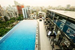 a swimming pool on the roof of a building at THE WAY Dhaka in Dhaka