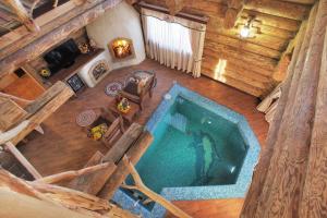 an overhead view of a swimming pool in a log cabin at Palais Royal in Yekaterinburg