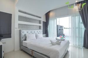 Ένα ή περισσότερα κρεβάτια σε δωμάτιο στο Le Leaf Valley Hua Hin 29