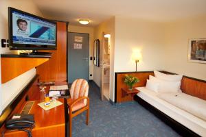 TV a/nebo společenská místnost v ubytování Advantage Appartements Hotel