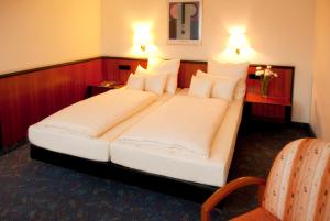 Postel nebo postele na pokoji v ubytování Advantage Appartements Hotel
