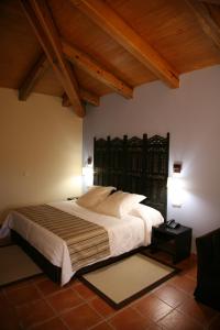 Giường trong phòng chung tại Hotel Convento Del Giraldo
