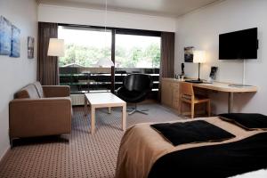 TV a/nebo společenská místnost v ubytování Munkebjerg Hotel