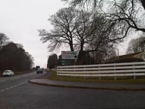 a sign on the side of a road at Sky Lodge Perth in Perth