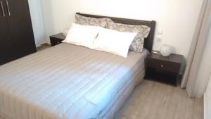 Postel nebo postele na pokoji v ubytování Dimitra Apartment