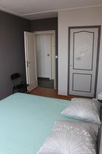 a bedroom with a bed and a door in it at nice in Nice