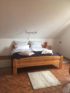 a bedroom with a bed with a lamp on it at DG Rechts 108A 2 Zimmer Apartment Dachgeschoss in Holzminden