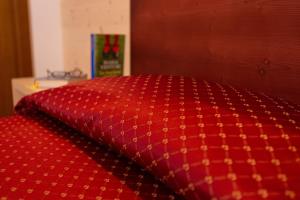 Ein Bett oder Betten in einem Zimmer der Unterkunft Hotel Residence Sirenella