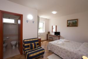 Postel nebo postele na pokoji v ubytování B&B Monelli