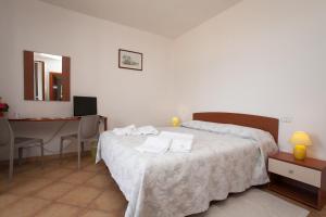 Postel nebo postele na pokoji v ubytování B&B Monelli