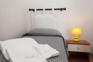 Postel nebo postele na pokoji v ubytování B&B Monelli