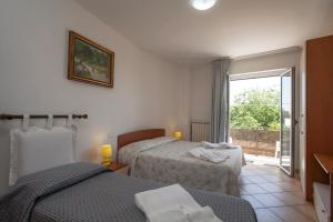 Postel nebo postele na pokoji v ubytování B&B Monelli