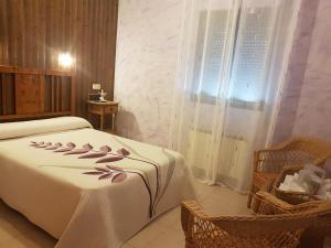 Ένα ή περισσότερα κρεβάτια σε δωμάτιο στο Hotel Carvajal