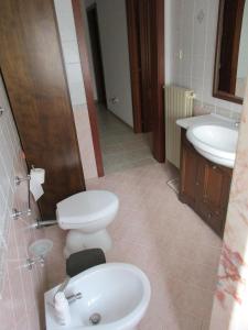 a bathroom with a toilet and a sink at Casa Dario in Melissano