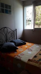 Postel nebo postele na pokoji v ubytování lakazadom974 - Chambres d'Hôtes