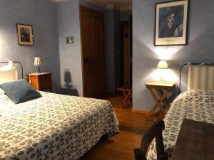 A bed or beds in a room at Domaine De Brousson