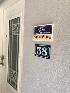 a sign on the side of a building with a window at Apartment Caesarea 38 in Caesarea