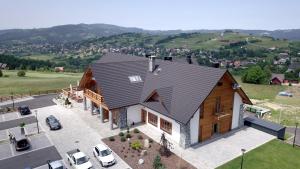 an overhead view of a house with a roof at Dwór Kukuczka in Istebna