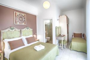Postel nebo postele na pokoji v ubytování Hotel Villa Esedra