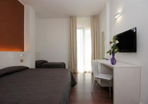 Postel nebo postele na pokoji v ubytování Hotel Aragosta + 32 fotografií