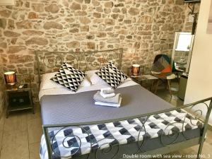 Кровать или кровати в номере City Rooms Šibenik