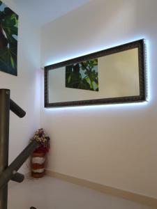 a mirror on a white wall in a room at Villa Marina in Omiš