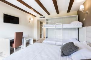 Cama o camas de una habitación en Hotel Atiana