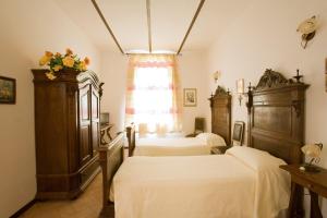 Postel nebo postele na pokoji v ubytování Villa Gioia Civita