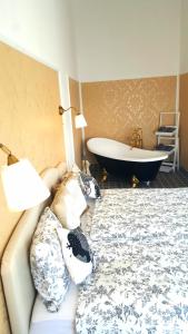 a living room with a couch and a bath tub at Apartments Villa Harmonie - Adults Only +14 in Crikvenica