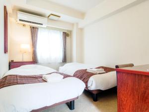 Postel nebo postele na pokoji v ubytování Sky Heart Hotel Koiwa