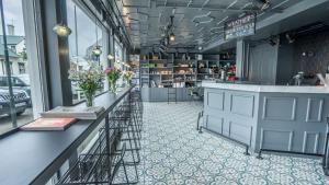 a store with a counter with flowers on it at Kvosin Downtown Hotel in Reykjavík