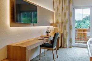A television and/or entertainment centre at Hotel Ennstalerhof