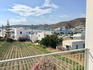 a view of a town from the balcony of a house at Pension Sofia Amorgos-Katapola in Katapola