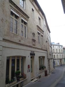 an old building on the side of a street at Hotel de Montaulbain in Verdun