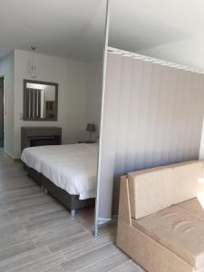 Cama ou camas em um quarto em Thassos Imperial Resort