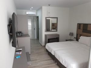 Cama ou camas em um quarto em Thassos Imperial Resort