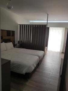 Cama ou camas em um quarto em Thassos Imperial Resort