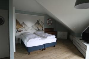a bedroom with a bed with a large mirror at Havelhotel in Brandenburg an der Havel