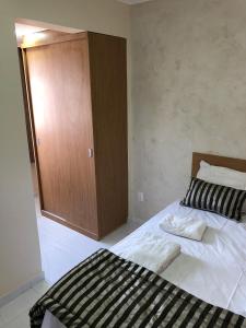 Cama o camas de una habitación en Fortaleza Flat Residence