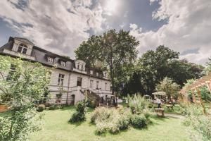 a large house with a garden in front of it at Gut Boltenhof in Fürstenberg +27 photos