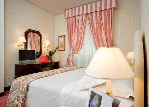 Letto o letti in una camera di Hotel De La Ville