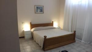 Posteľ alebo postele v izbe v ubytovaní Hotel Firenze 2000