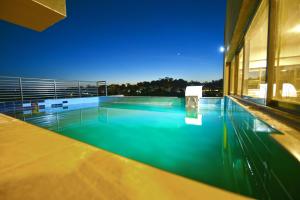 a swimming pool in the middle of a building at K Hotels Entebbe in Entebbe