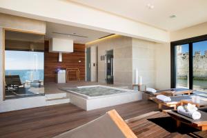 a large bathroom with a jacuzzi tub at Grand Hotel Terme Sirmione in Sirmione