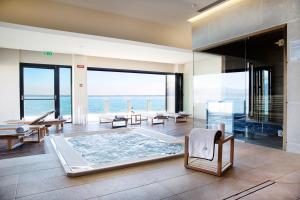 a living room with a view of the ocean at Grand Hotel Terme Sirmione in Sirmione