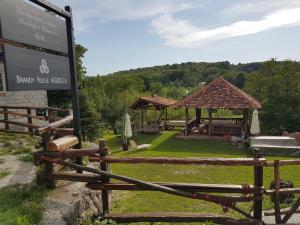 a sign in front of a park with a gazebo at Brandy House Hedonica in Otruševec