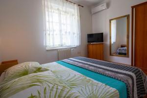 Cama o camas de una habitación en Vila Niko