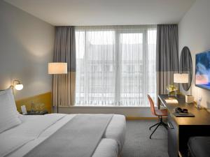 Säng eller sängar i ett rum på K+K Hotel Fenix