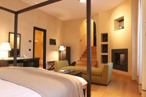 Posteľ alebo postele v izbe v ubytovaní Heritage Hotel Kukuriku